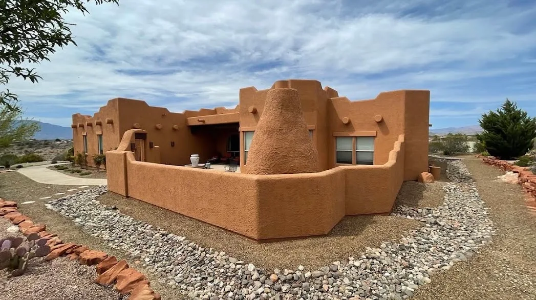 Freshly painted Southwest stucco home with desert landscaping, painted by JLM Painting